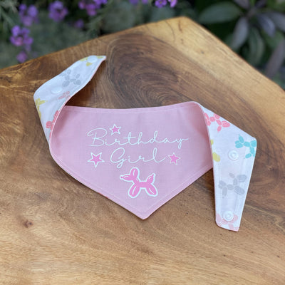 Soft pink "Birthday Girl" dog bandana with popper fixing.