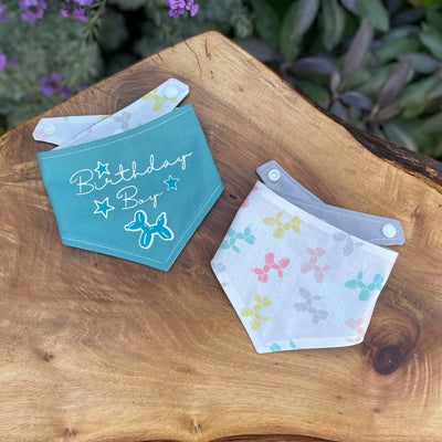 Teal blue "Birthday Boy" motif dog bandana with dog balloon fabric reverse