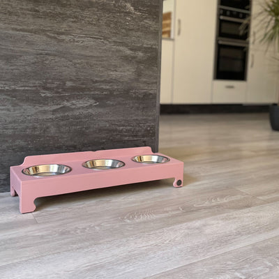 Triple-bowl feeding stand in blush pink.