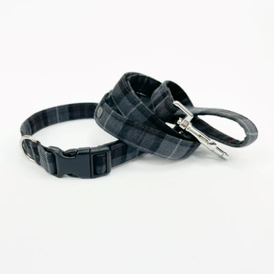 Matching dog collar and lead in charcoal grey tartan fabric. 