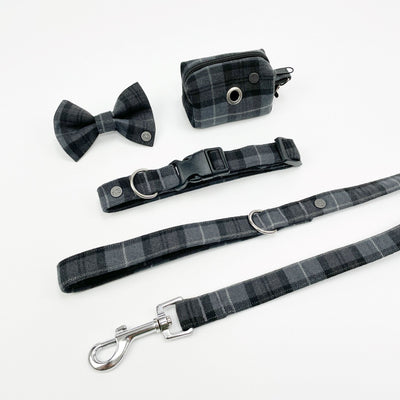 Charcoal grey tartan dog accessory set including collar, lead, bow tie, poop bag holder.