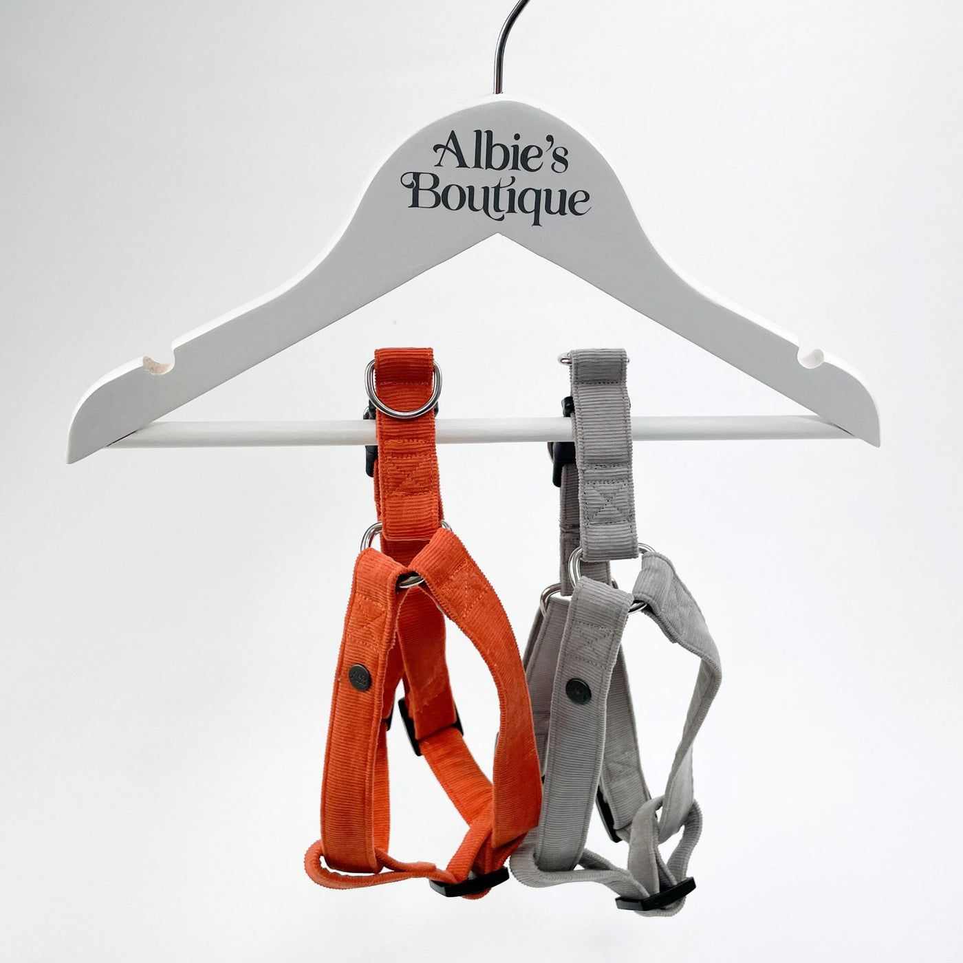Silver Grey Corduroy Step-In Dog Harness alongside burnt orange variation. 