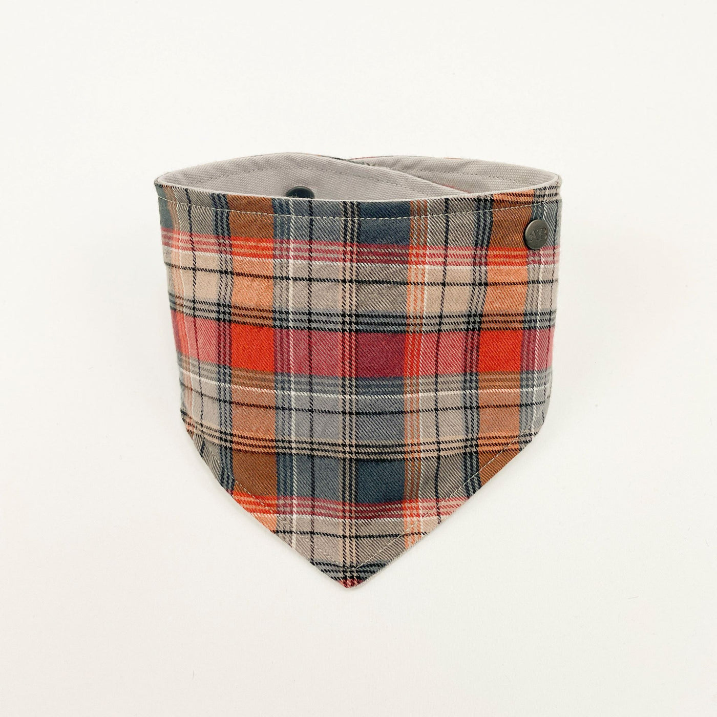 Grey and Orange Autumn Check Dog Bandana fastened up.
