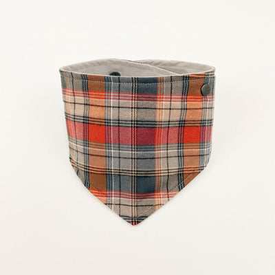 Grey and Orange Autumn Check Dog Bandana fastened up.