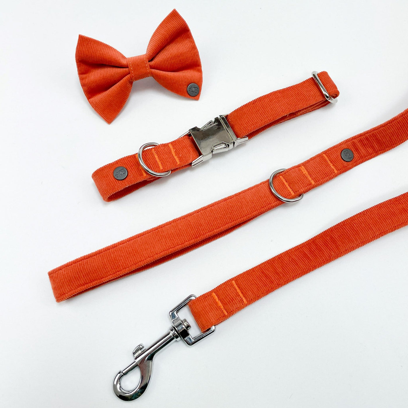 Orange Corduroy dog accessory range includes lead, collar and bow tie.