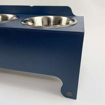 Navy raised dog bowl feeding station.