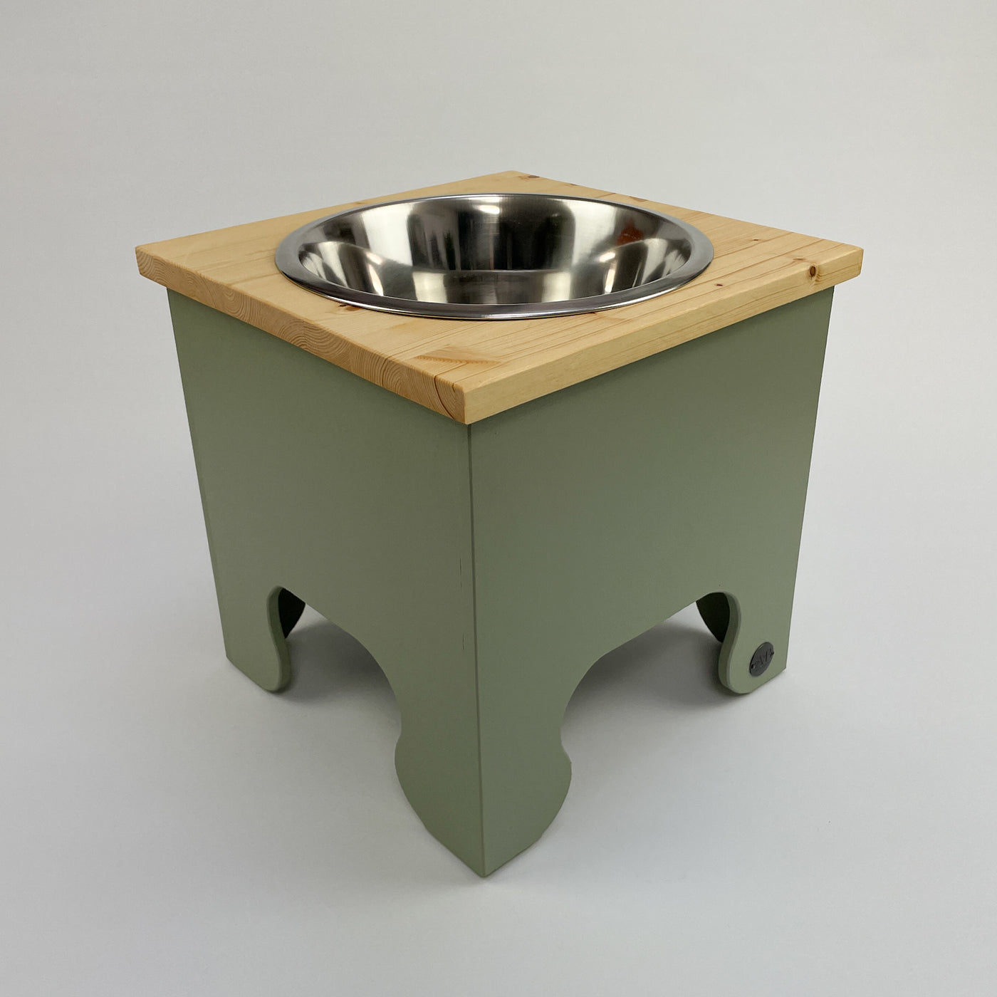 A soft green, pine top raised single bowl dog feeding stand in extra large.