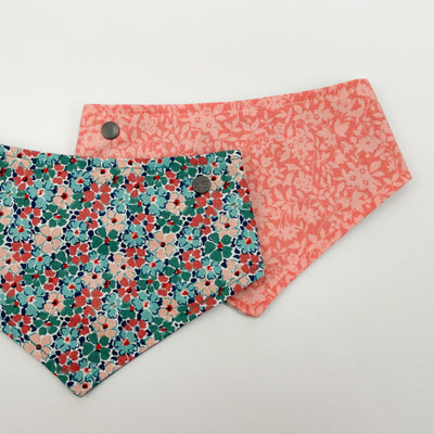 Reversible dog bandana in Liberty Winter Floral fabric with peach floral fabric reverse.