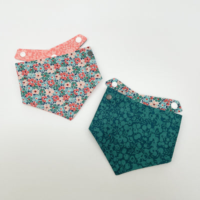 Liberty Winter Floral Dog Bandana shown alongside emerald winter berry floral fabric reverse.