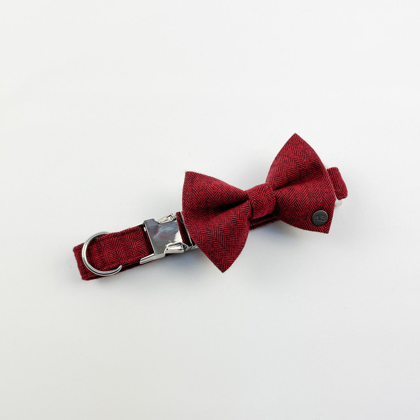 Cranberry herringbone dog bow tie on a matching collar