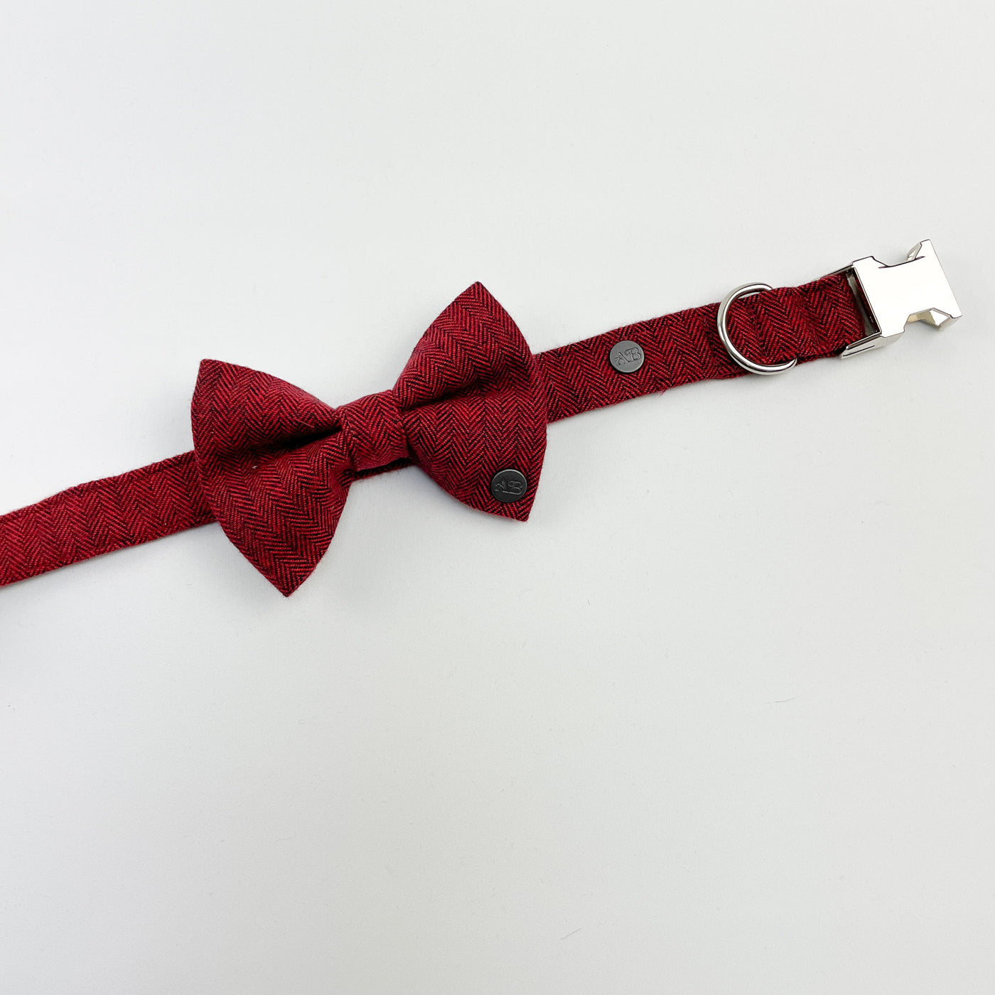 Cranberry herringbone dog bow tie on a matching collar