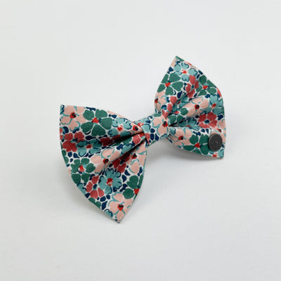 Liberty winter floral bow with Albie's seal of quality. 