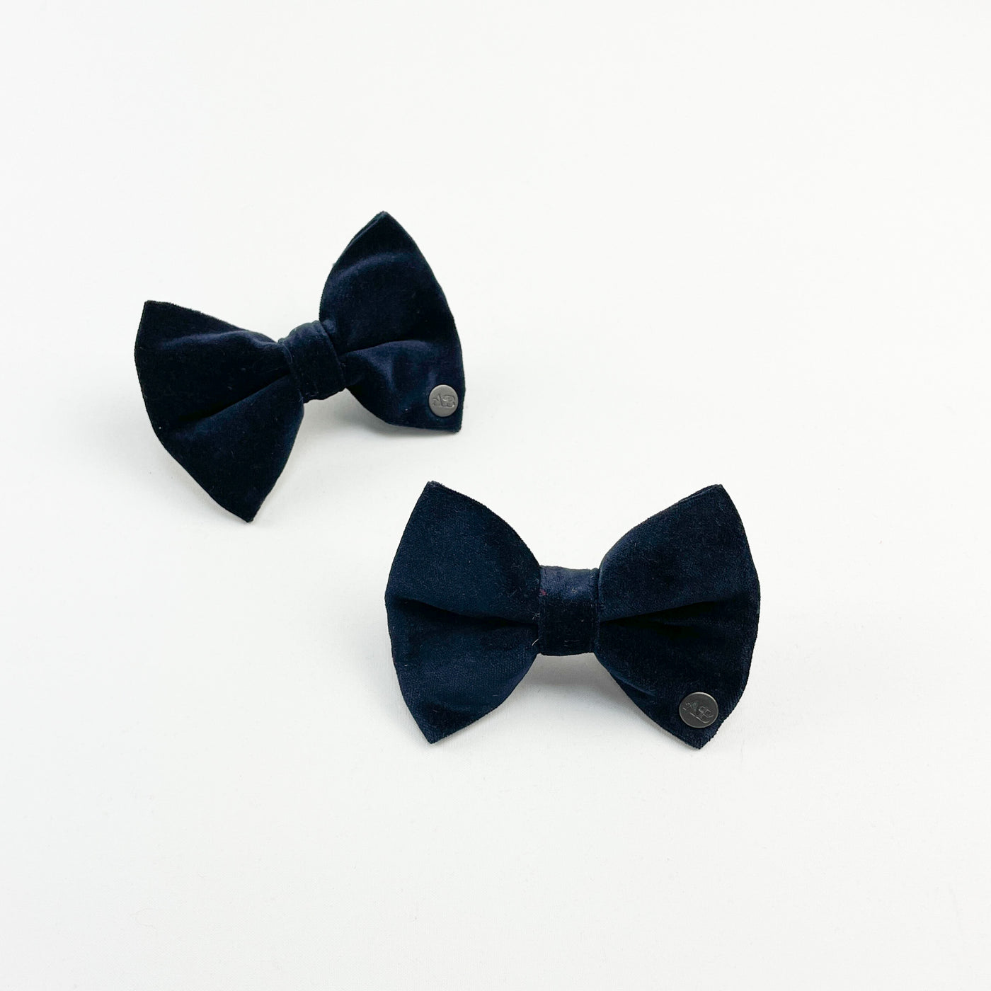 two navy velvet bow ties
