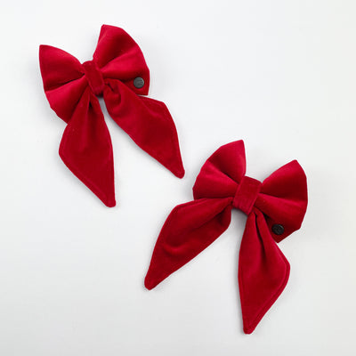Two red sailor bow ties