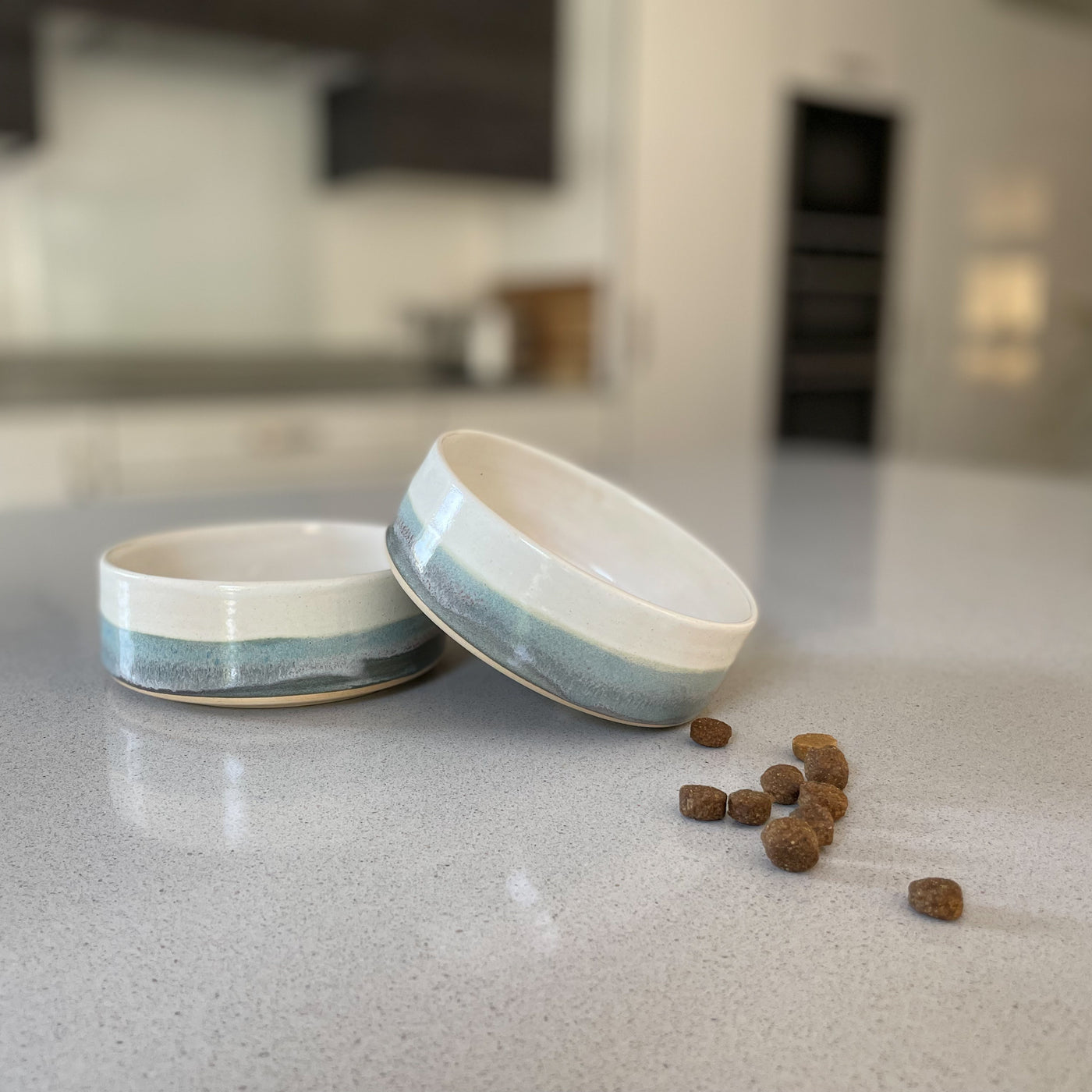 Ceramic dog food bowl in a two-tone speckled grey glaze.