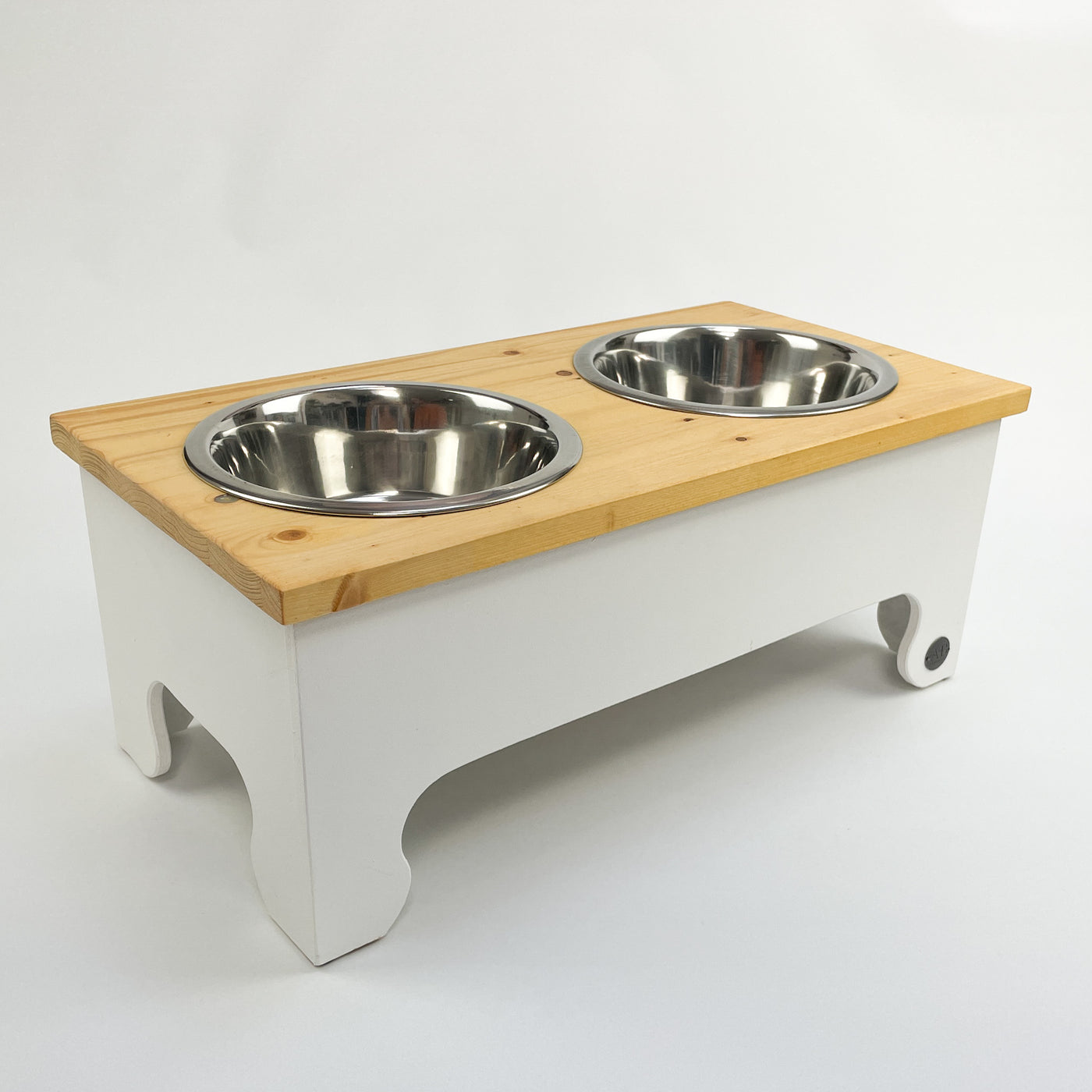 Raised dog bowl feeding stand, white with a natural pine top.