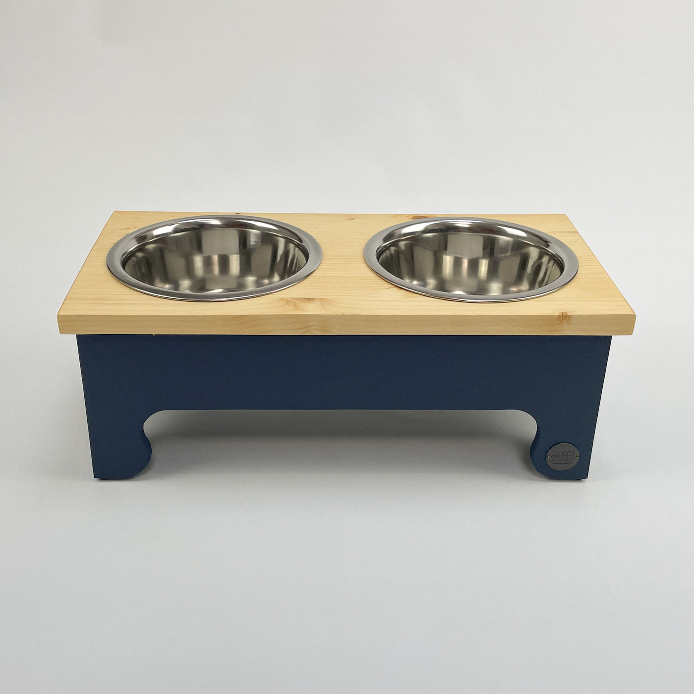 Navy, medium sized, pine top, raised dog bowl feeding stand