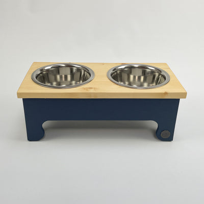 Navy, medium sized, pine top, raised dog bowl feeding stand