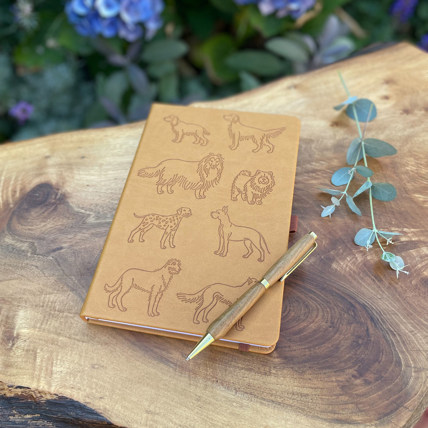 "All the Dogs" vegan Leather Notebook, embossed with different dog breeds on the cover