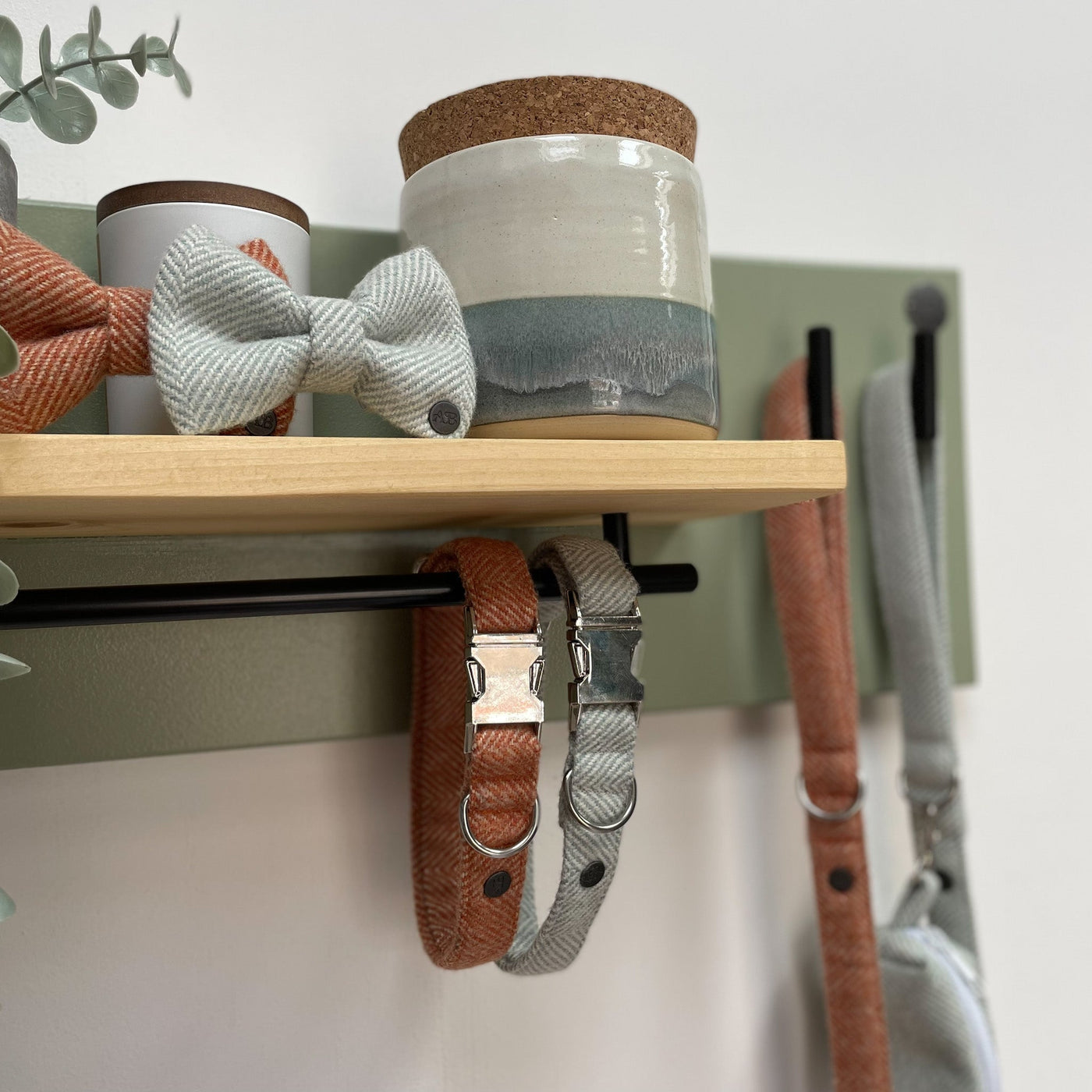Soft green lead station with pine shelf and contemporary black matt fittings.
