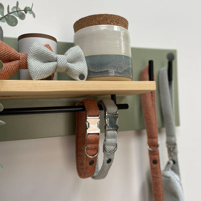 Soft green lead station with pine shelf and contemporary black matt fittings.