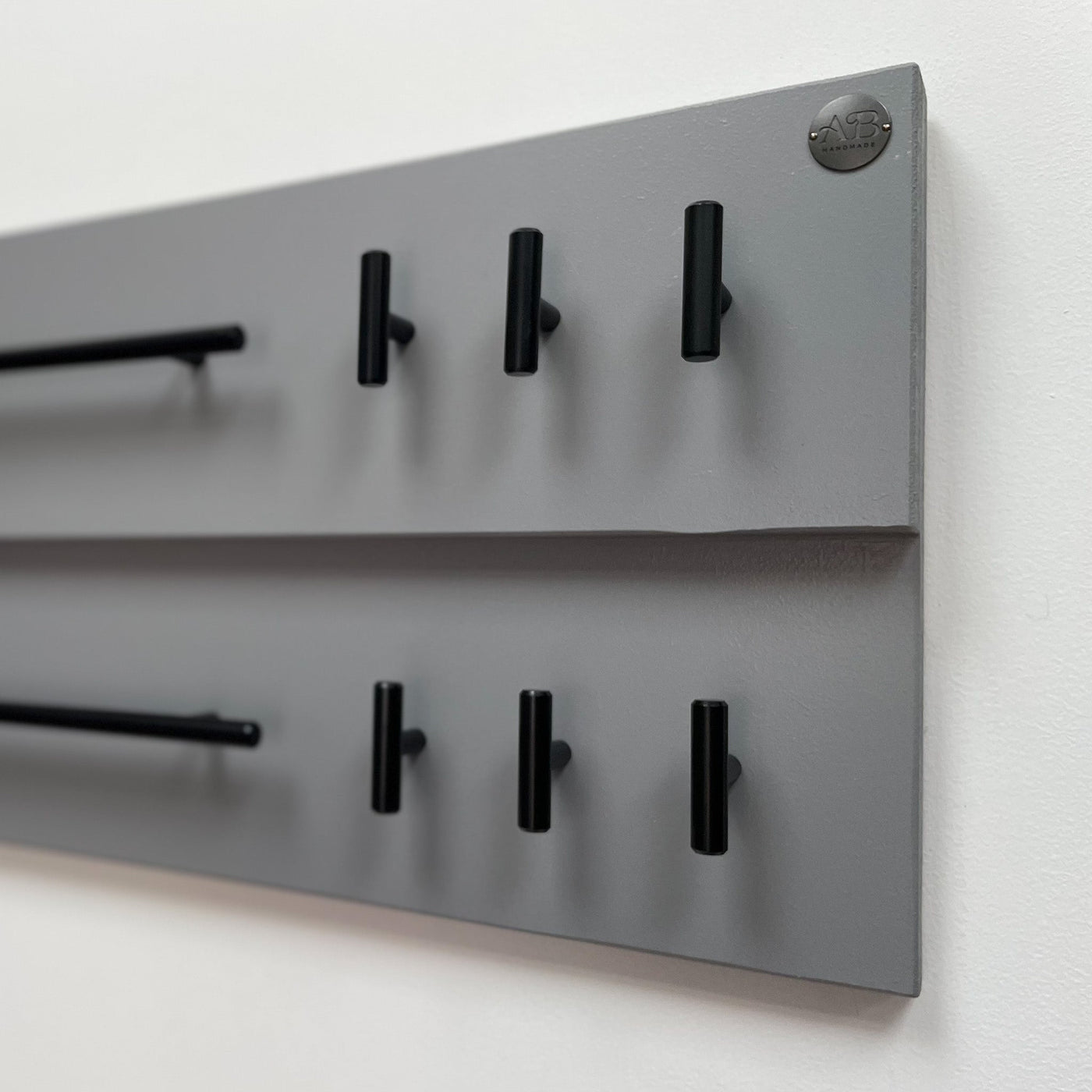 Grey double-rail dog lead station with contemporary black matt fittings and Albie's Boutique seal of quality.