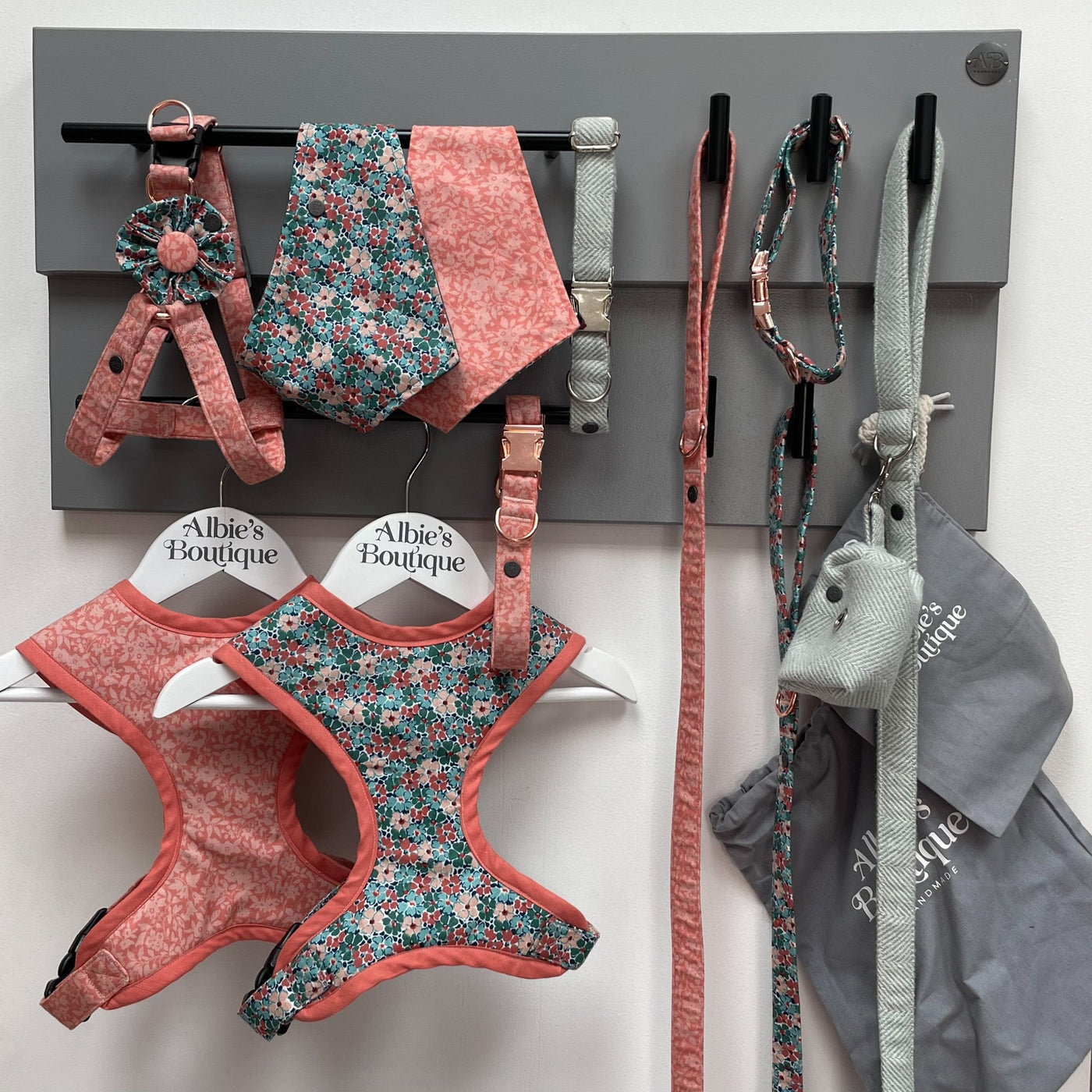 Albie's Boutique large double-rail dog lead station with hanging dog walking accessories.